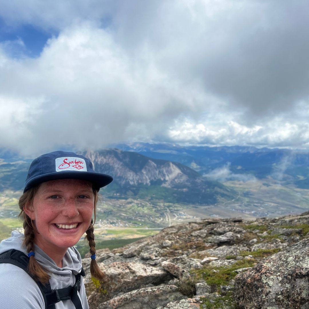 Photo of Coco on top of a mountain.