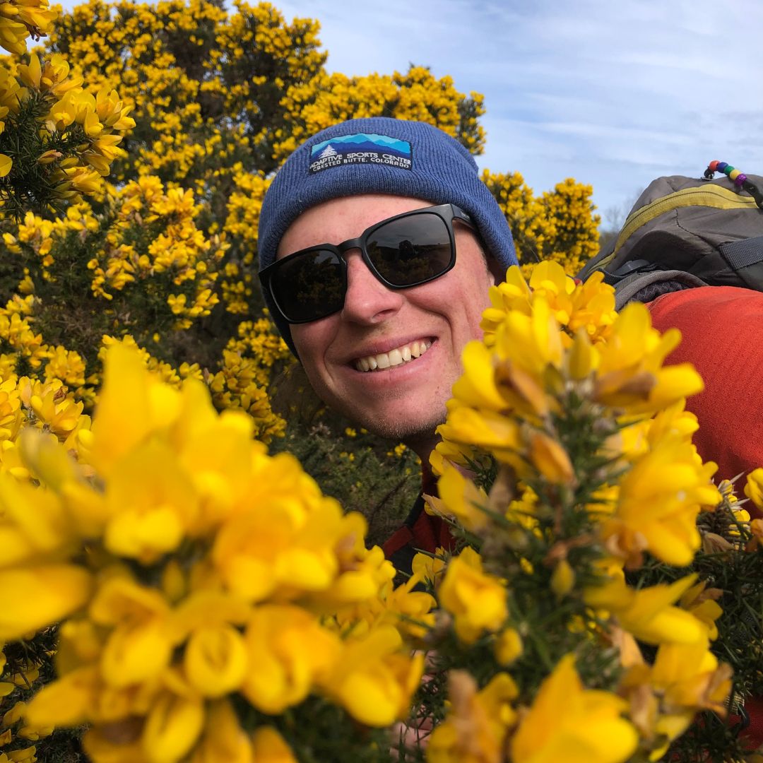 Photo of Tyler with flowers.