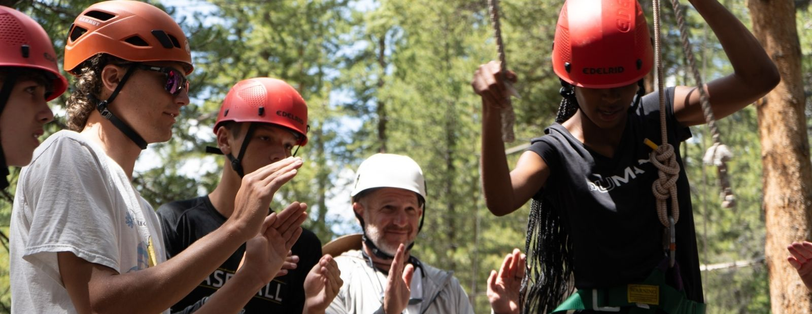 participant on low ropes bridge